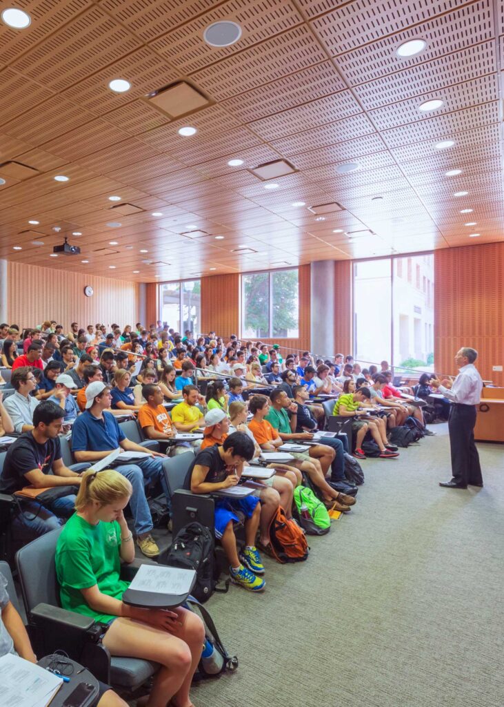 Professor speaking to a large classroom of students